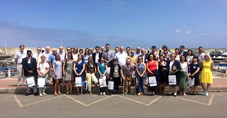 Group shot of participants on the sea front
