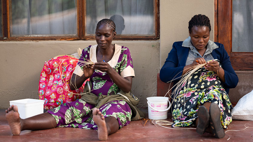 Photo of women weaving