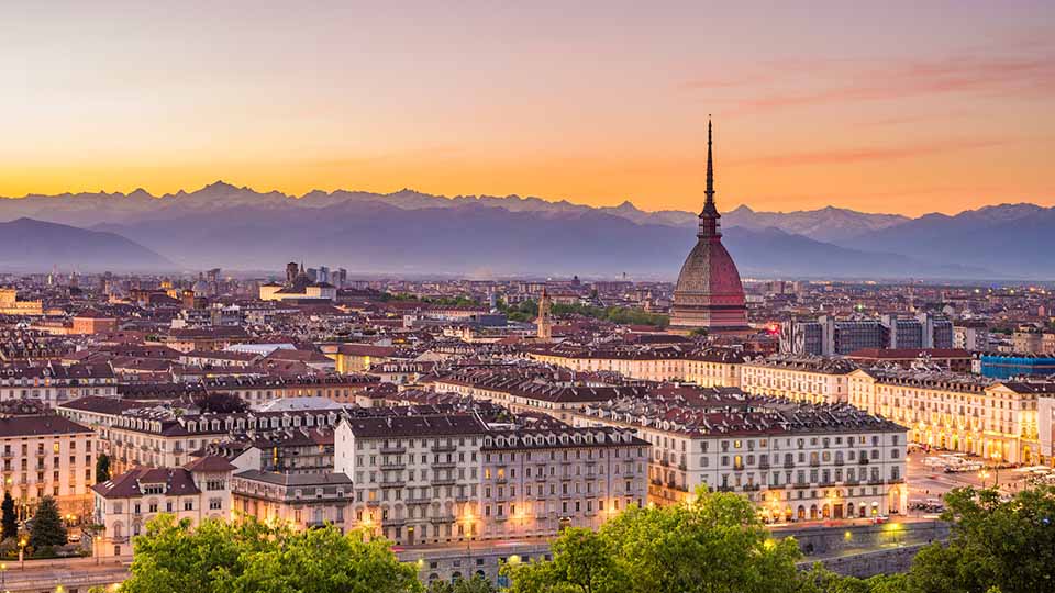 Cityscape of Torino (Turin, Italy) at dusk with colorful moody sky