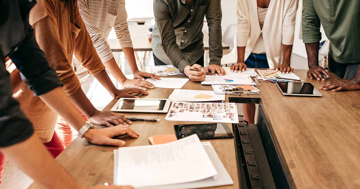 Hands over the table as a business concept