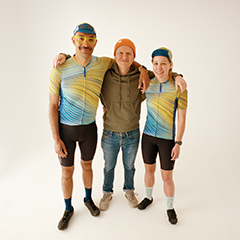 Kostüme’s company founder Ed Bartlett, with two cyclists who are wearing the company’s cycling gear.