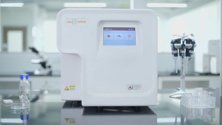 The SigTuple AI100 scanner which can convert a physical specimen into digital images and upload to the cloud