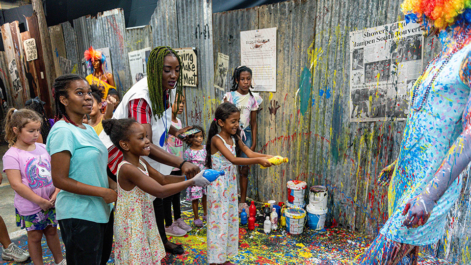 Children visiting the Trinidad and Tobago Carnival Museum enjoying an interactive exhibit