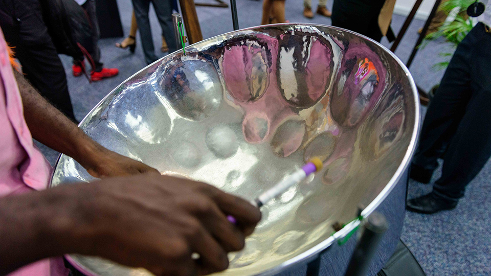 A steel pan player performing at the “The Evolution of Steel Pan in Art” exhibition of the Trinidad and Tobago Carnival Museum