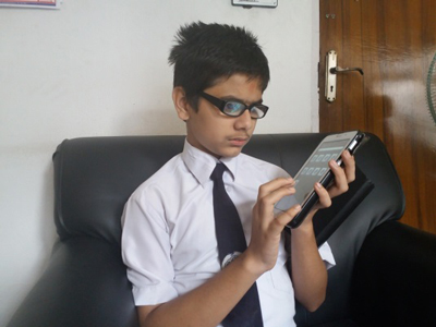 Photo of Jaldeep listening to his tablet
