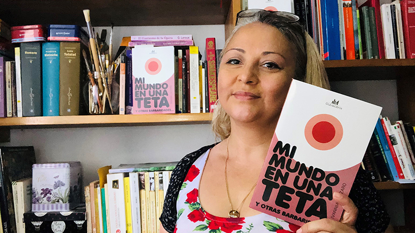 Ivannia with her published anthology, Mi Mundo En Una Teta.