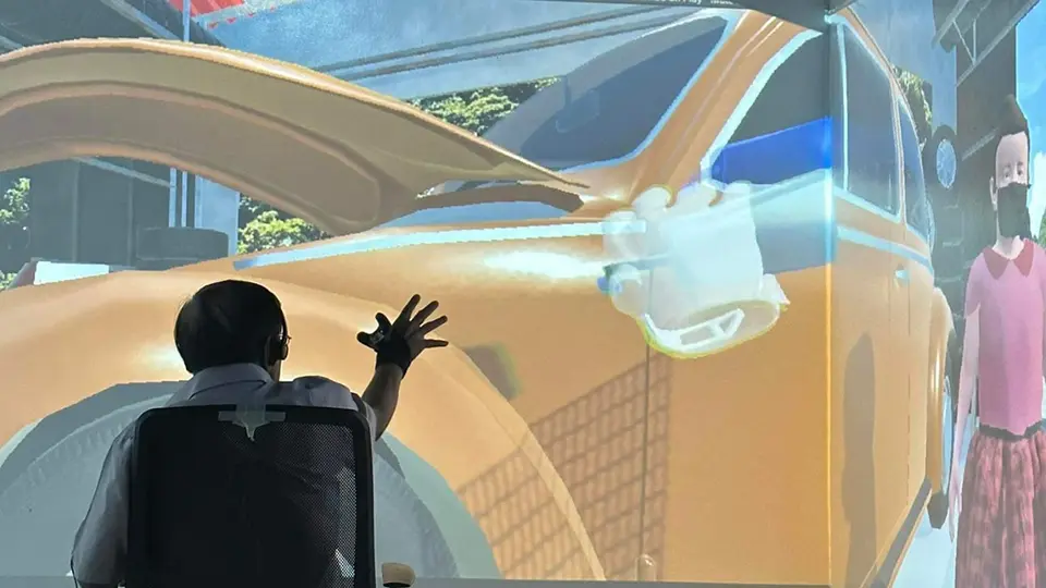 A man in a chair testing AXEL Virtual Care game