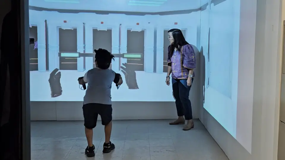 A child exercising with the AXEL Virtual Care game