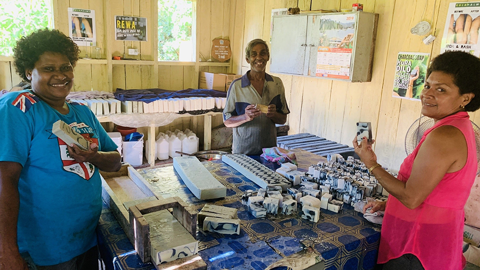 Kula Palms Fiji staff members in the workshop where soaps are cut into bars