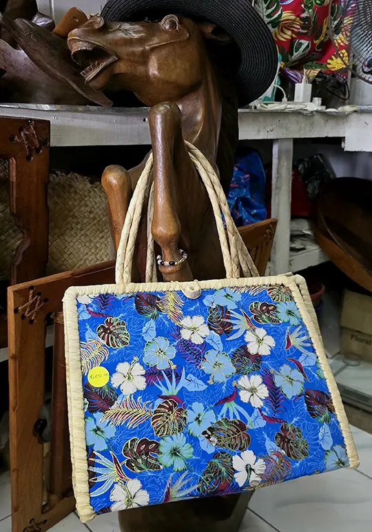 Terry Sherren Salote's handmade bag over a wooden sculpture