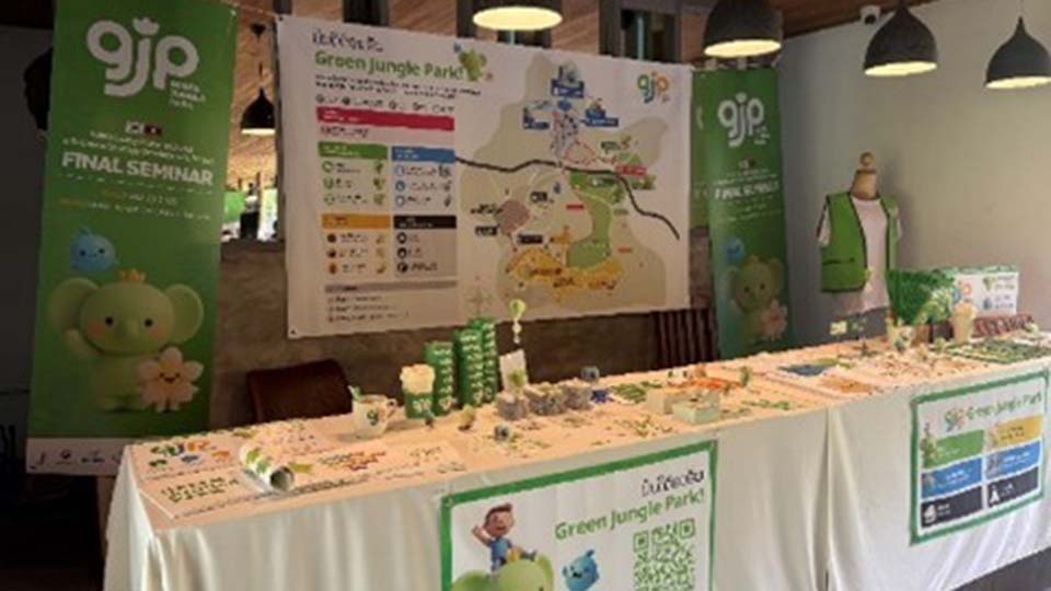 Green Jungle Park (GJP) Final Seminar display table with banners, a park map, and branded products