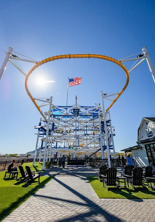 Large outdoor aerial adventure course with a looping overhead track.