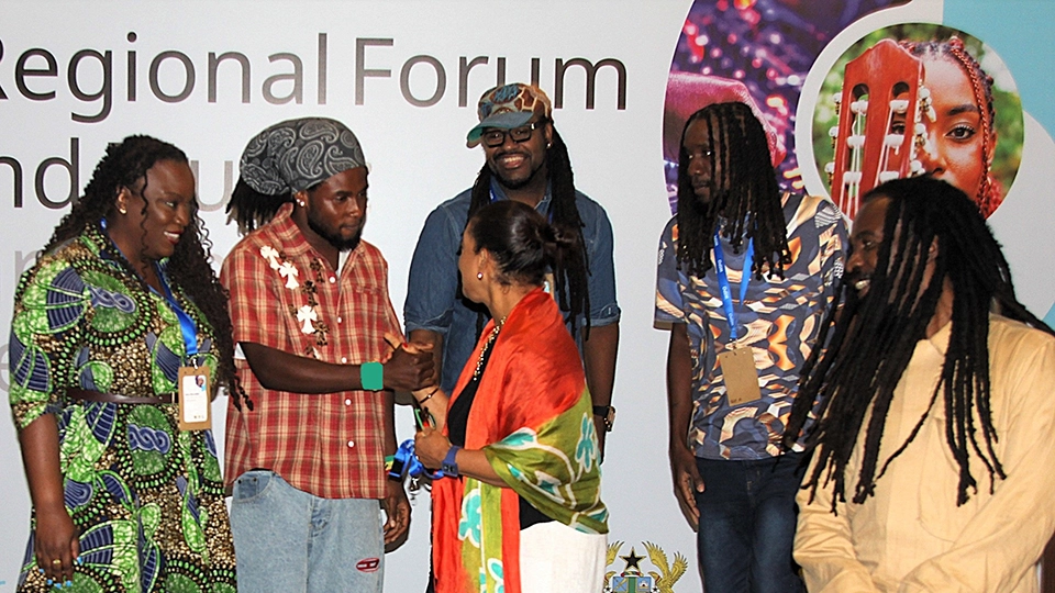 Young Ghanian dancehall artist Gunnyboy being congratulated by participants and organizers after his performance at the Cross-Regional Forum on IP and Music: Afro-Caribbean Creative Bridge.
