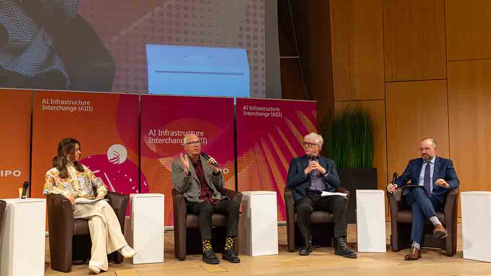 Four panelists discussing AI infrastructure at WIPO event