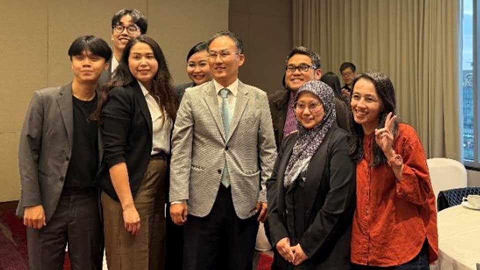 Small group of WIPO-ASEAN training participants posing with a trainer after the IP and Market Strategy Training session