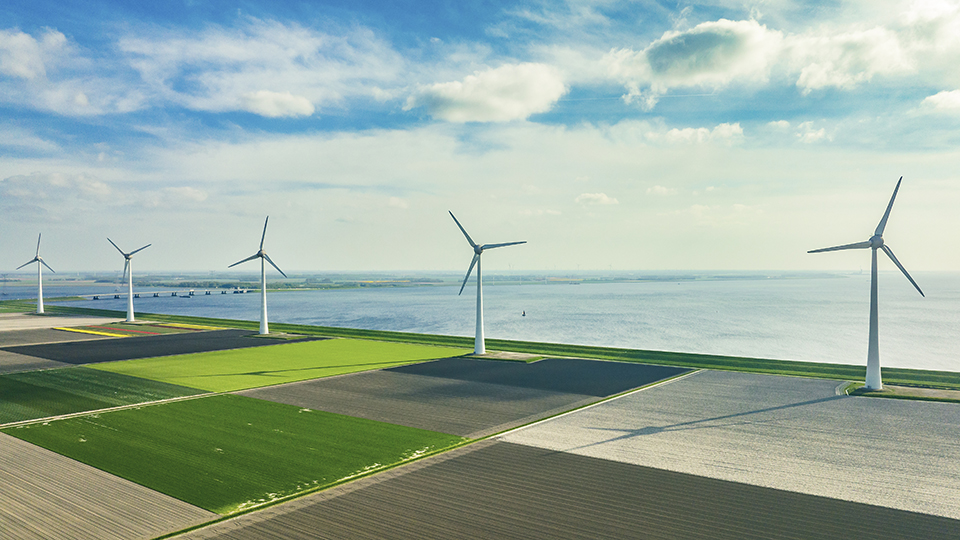 Wind turbines on the shore of a lake