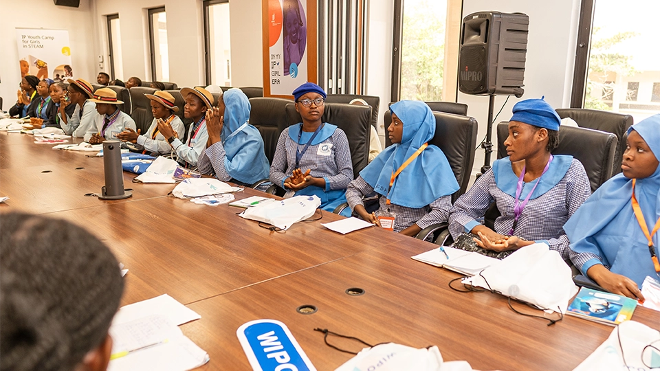 Participants of the first IP Youth Camp for Girls in STEAM sitting around the table, listening to experts on the importance of IP. Event held in Abuja, Nigeria from April 21 to 24, 2026