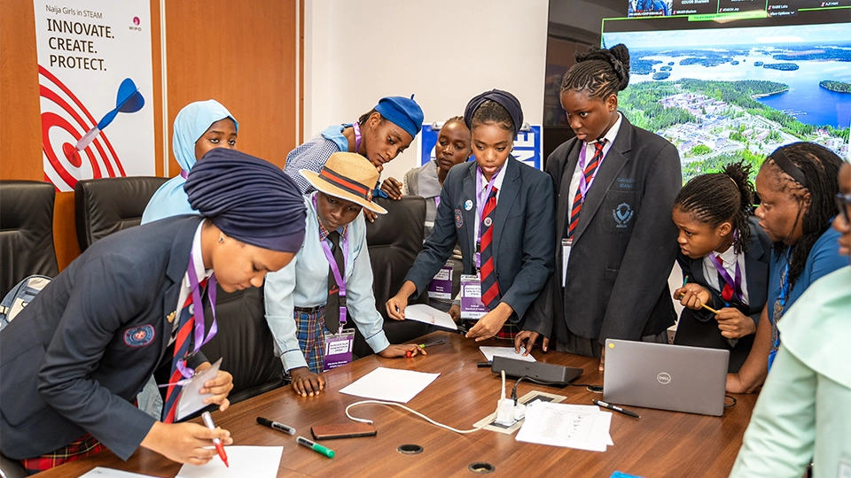 Participants working in groups during the first IP Youth Camp for Girls in STEAM, to create their inventions. 