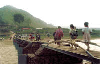 School children from Maosi village in Gansu Province, China, commute safely to school across the bridge that they helped build. (Courtesy INDEX Awards)