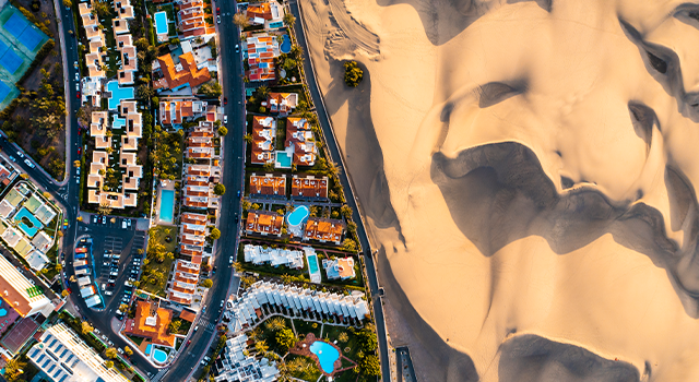 Overhead view of cityscape and sand dunes in Maspalomas, Grand Canary, Spain