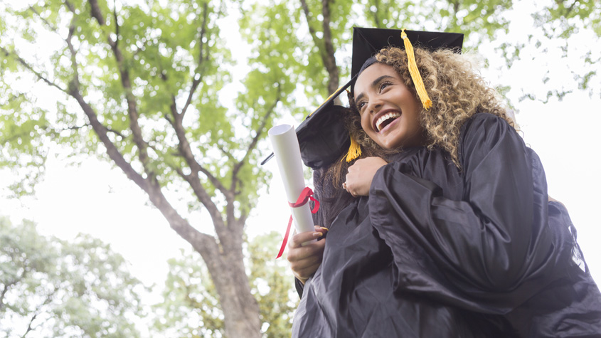 Graduates of the WIPO Academy Joint Master in IP hugging each other at their graduation ceremony