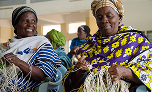 Two women weaving sisal baskets