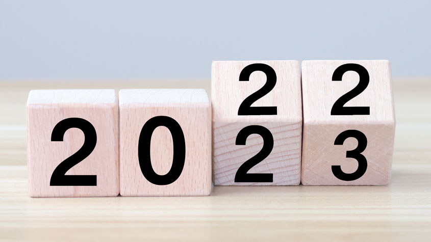 2022/2023 woodblocks cubes on wooden table and gray background