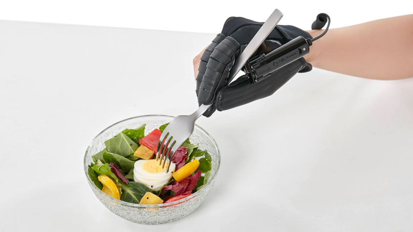 Photo of the Neomano robo-glove in action