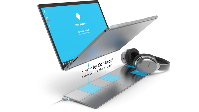 Photo of a laptop, with the Energysquare trademark displayed on the screen, and Power by Connect conductive tiles.