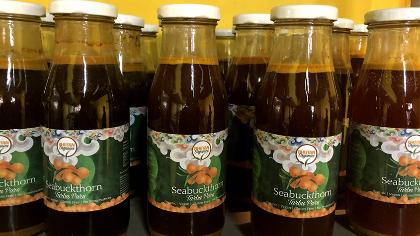 Bottles of Bhutan Organics sea buckthorn syrup