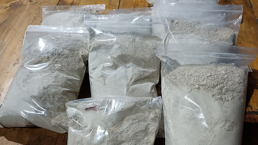 Several plastic pouches filled with organic buckwheat flour