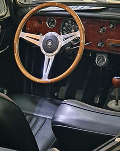Interior of a classic Herald car converted into an electric car