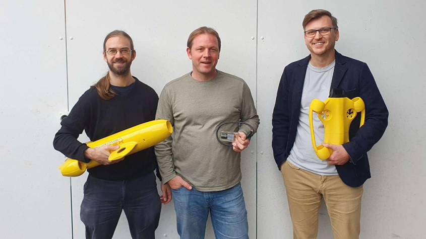 The three founders of Hydromea, Felix Schill (who holds the Vertex Autonomous underwater swarm), Alexander Bahr and Igor Martin (who holds the Exray wireless ROV)