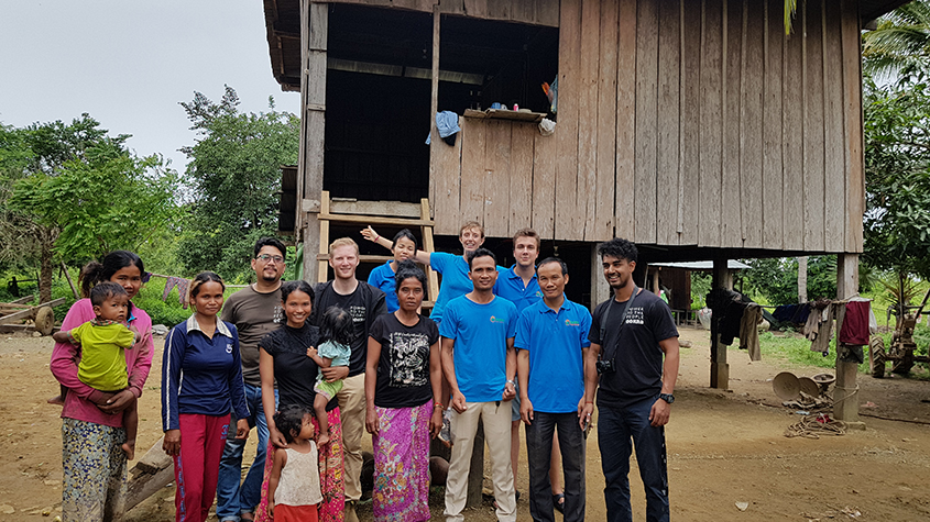 Okra Solar’s team with a rural community who has installed mesh-grids