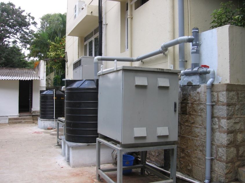 Filtered rainwater flows up through the PopUp Filter and into storage tanks connected to it.