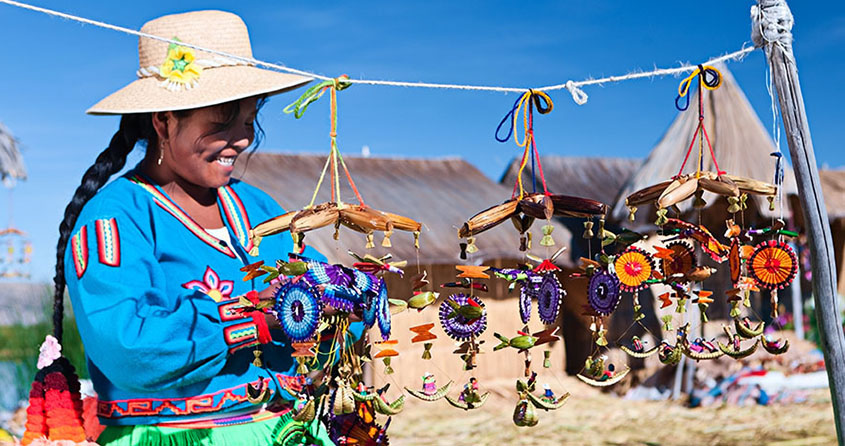 Uros woman selling souvenirs on floating island