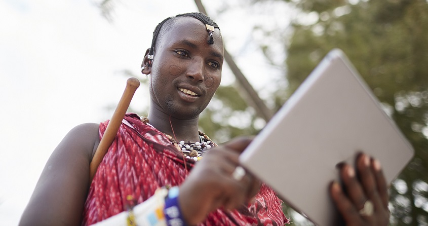 Maasai nomadic man using a tablet