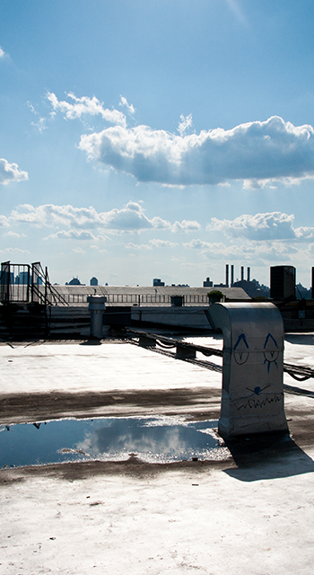 Brooklyn Rooftop with Manhattan Skyline as Background in sunny afternoon
