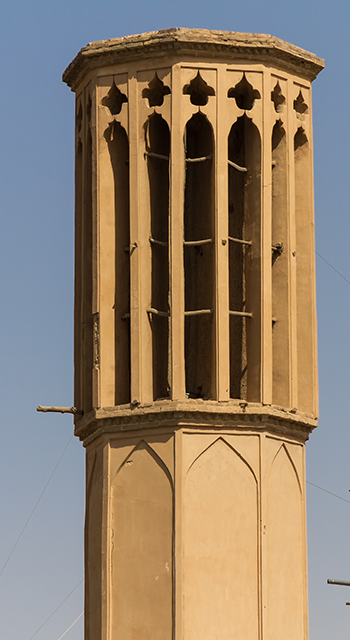 Rooftop Badgirs (windtowers) in the mud-brick desert city of Yazd, Iran. An ancient airconditioning system that captures the wind for cooling the houses below.