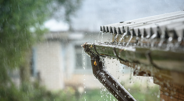 rain flows down from a roof down