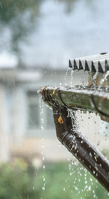 rain flows down from a roof down
