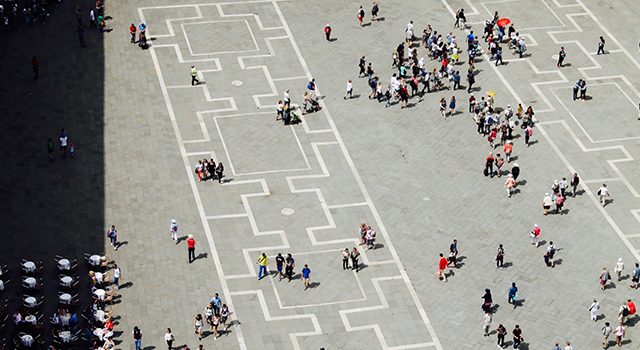 High Angle View Of People Walking On Footpath During Sunny Day - stock photo