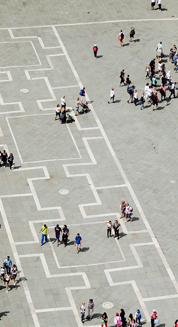 High Angle View Of People Walking On Footpath During Sunny Day - stock photo