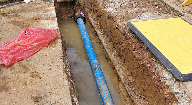 Removing burst asbestos water pipes and replacing with modern plastic tubes
