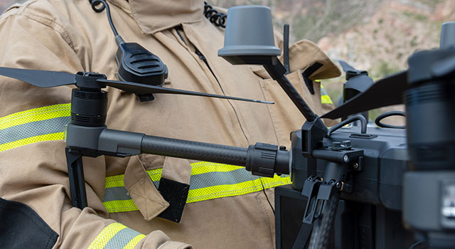 firefighter operating drone in search and rescue