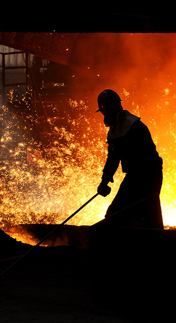 The worker in front of the blast furnace,