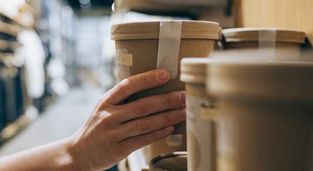An unrecognizable female customer choosing things she wants to buy.