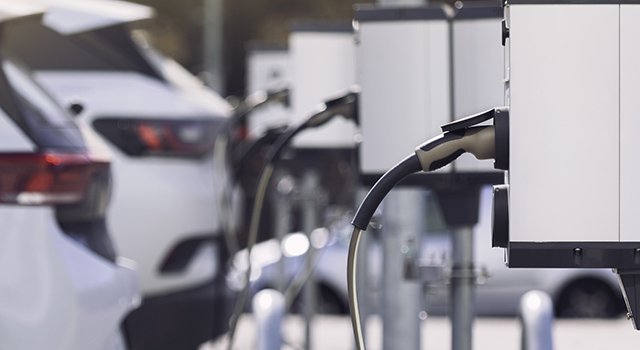 A parking lot with charging stations for electric cars.