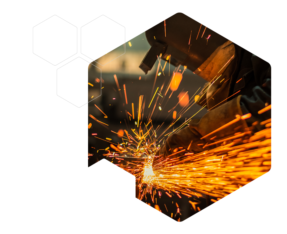 Metal worker using a grinder