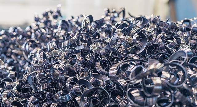 a pile of metal shavings. spirals and zigzags made of metal. production waste